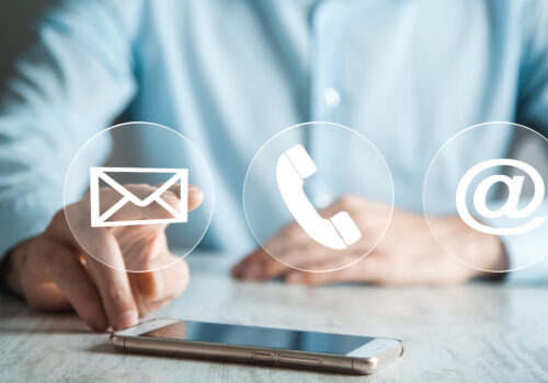 Businessman hand phone with virtual buttons